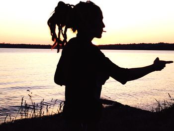 Silhouette of people at sunset