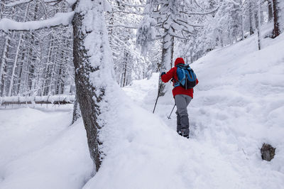Man skiing on snow covered field