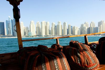 Panoramic view of sea and buildings against sky