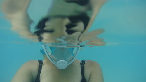 Close-up of woman swimming in pool