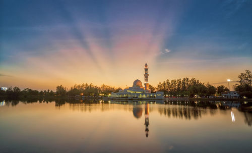 Scenic view of lake against sky during sunset