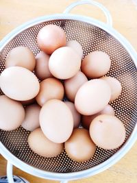 High angle view of eggs in container on table