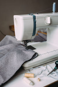 Sewing machine, accessories and fabric. cozy creative sewing process at home