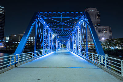  blue bridge of downtown grand rapids glows vibrant after dark