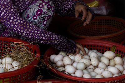 Various fruits in basket for sale at market stall