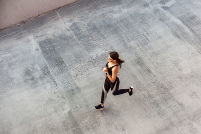 High angle view of woman running