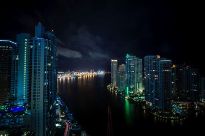 Illuminated city at waterfront