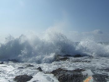 Waves splashing on rocks