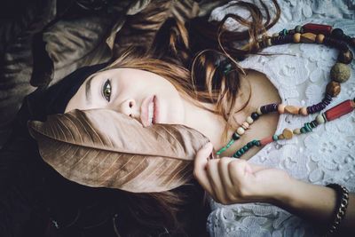 Portrait of a girl lying down on bed