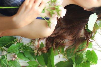 Close-up of woman with rose bouquet