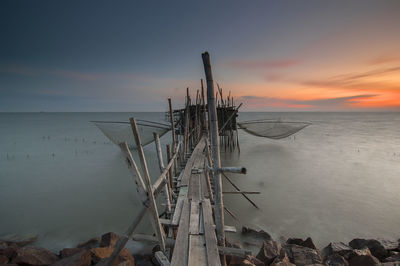 Scenic view of sea against sky at sunset