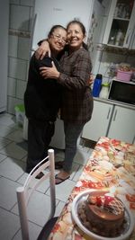 Happy friends standing in plate