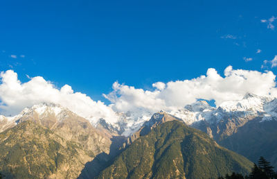 Scenic view of snowcapped mountains against sky