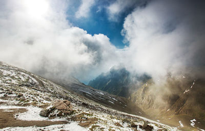 Scenic view of mountains against sky during winter