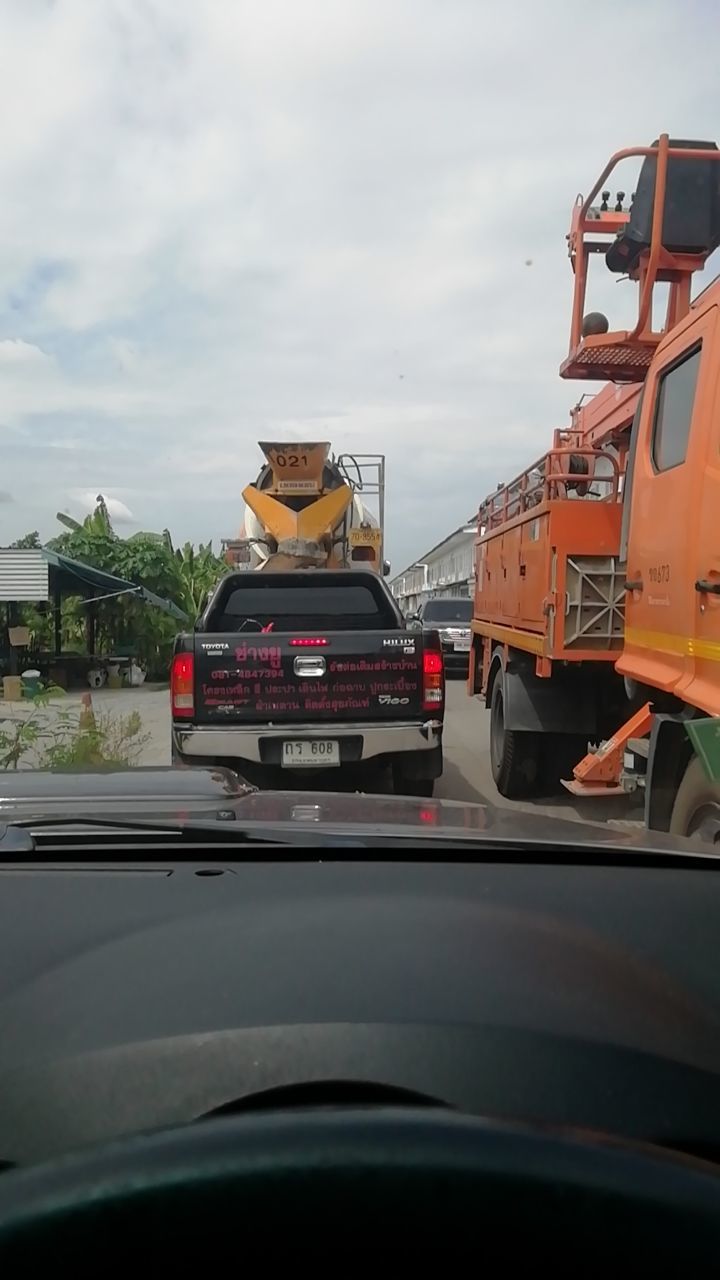 mode of transportation, land vehicle, motor vehicle, car, transportation, windshield, sky, cloud - sky, road, car interior, vehicle interior, truck, no people, day, glass - material, nature, transparent, control panel, outdoors, semi-truck