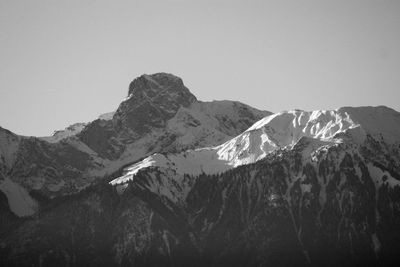 Scenic view of snowcapped mountains against clear sky