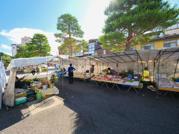 People at market stall in city