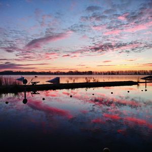 Scenic view of calm lake at sunset