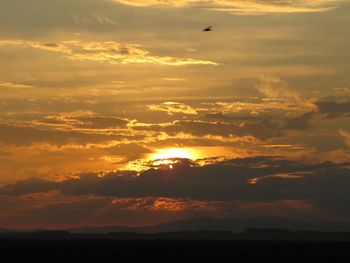 Scenic view of dramatic sky during sunset