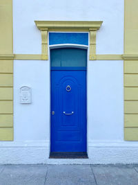 Closed  blue door of building