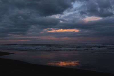 Scenic view of sea against dramatic sky