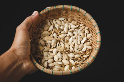High angle view of human hand on black background