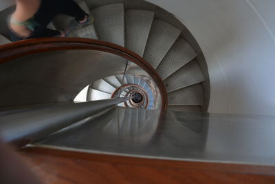 High angle view of man standing on spiral staircase