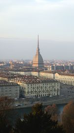 Buildings in city against sky