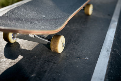 Low section of skateboard on road