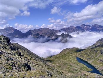 Sea of clouds and glacial lake viewed from above