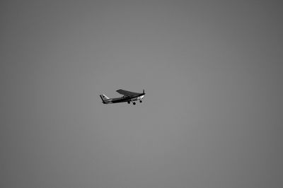 Low angle view of airplane against clear sky