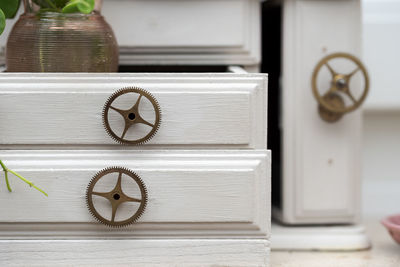 Close-up of door handle on table