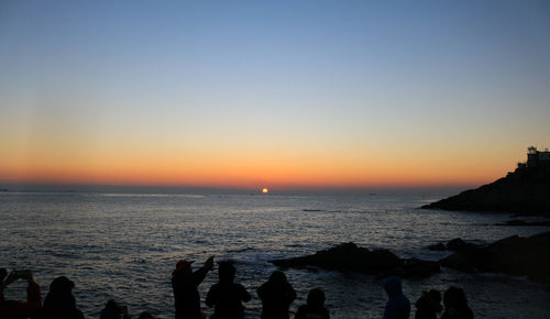 Scenic view of sea at sunset