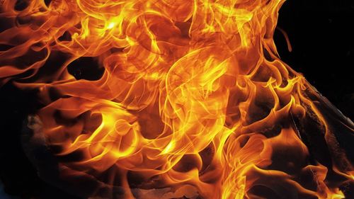 Close-up of bonfire against black background