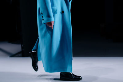 Casual women fashion, long autumnal blue coat and black boots details, fancy clothes outfit