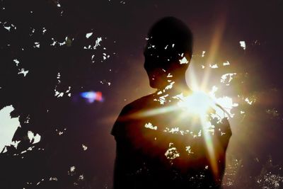 Low angle view of illuminated people at night