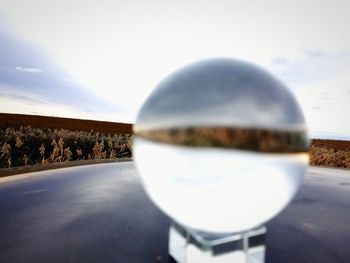 Close-up of crystal ball on road