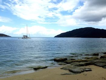 Scenic view of sea against cloudy sky