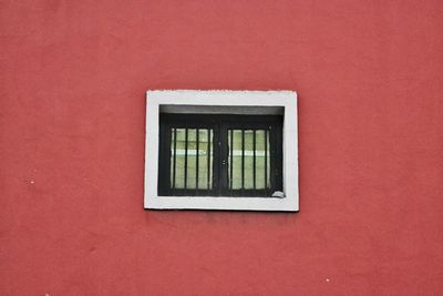 Close-up of window on brick wall