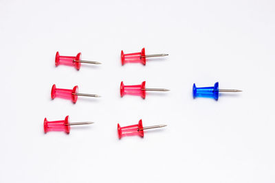 Multi colored umbrellas against white background