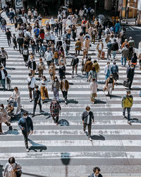 High angle view of people walking on street