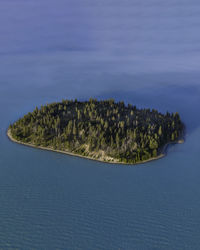 Scenic view of an tiny island in the middle of a glacier lake