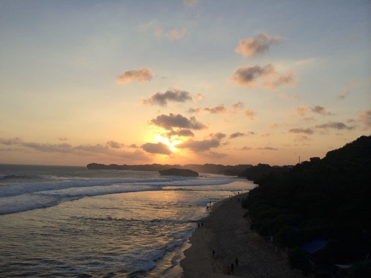 sea, water, beach, sunset, horizon over water, scenics, shore, sky, beauty in nature, tranquil scene, tranquility, nature, coastline, idyllic, cloud - sky, wave, rock - object, orange color, sand, outdoors