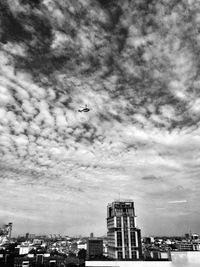 Low angle view of airplane flying in sky