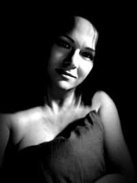 Portrait of beautiful young woman in darkroom