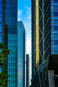 Low angle view of skyscrapers against sky