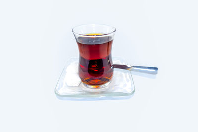 Close-up of tea cup against white background