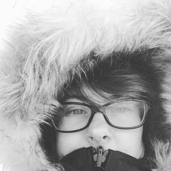 Close-up portrait of person wearing fur coat