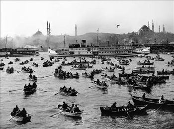 Boats moored at harbor