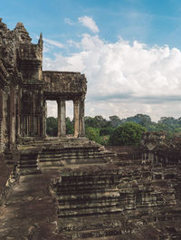 Old ruins of temple against cloudy sky